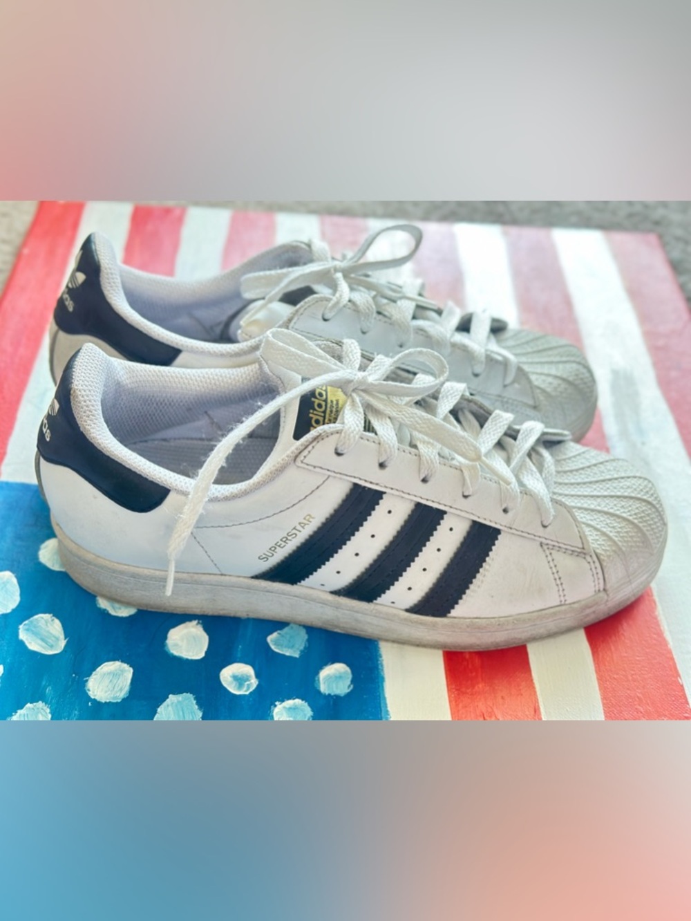 adidas White and Black Superstar Sneakers with Gold Logo